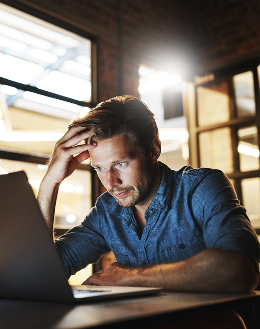 Depressed, man or anxiety with laptop or error for project deadline mistake, news or phishing website. Night, hacked or security engineer with stress for startup crisis, digital fraud or online scam.